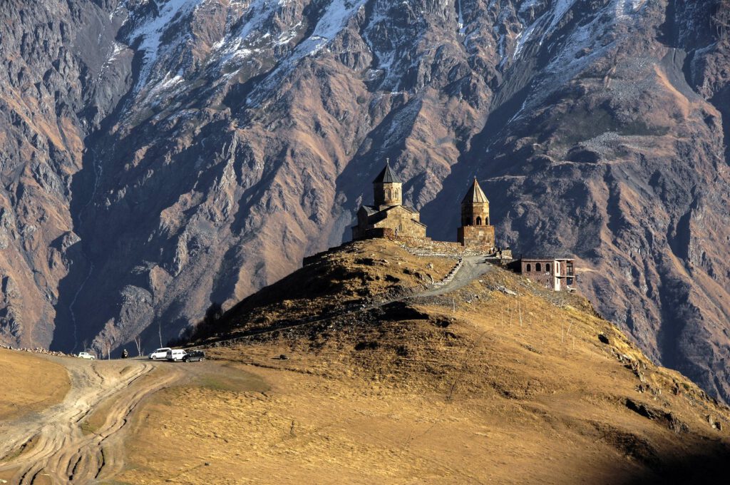 View to Gergeti Church at the foothills of Mount Kazbek
