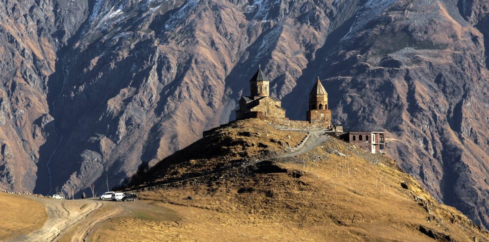 View to Gergeti Church at the foothills of Mount Kazbek